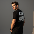 Man wearing a black t-shirt with 'Saint Louis Future Vintage' text on a gray background