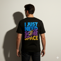 Person wearing a FABURE black t-shirt with colorful text and an astronaut graphic on the back.