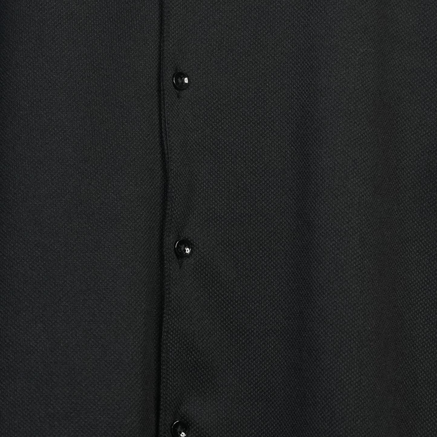 Fabure Close-up of a black textured shirt