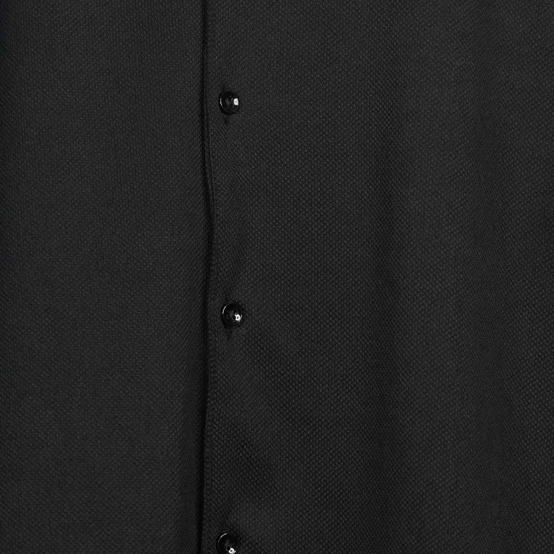 Fabure Close-up of a black textured shirt