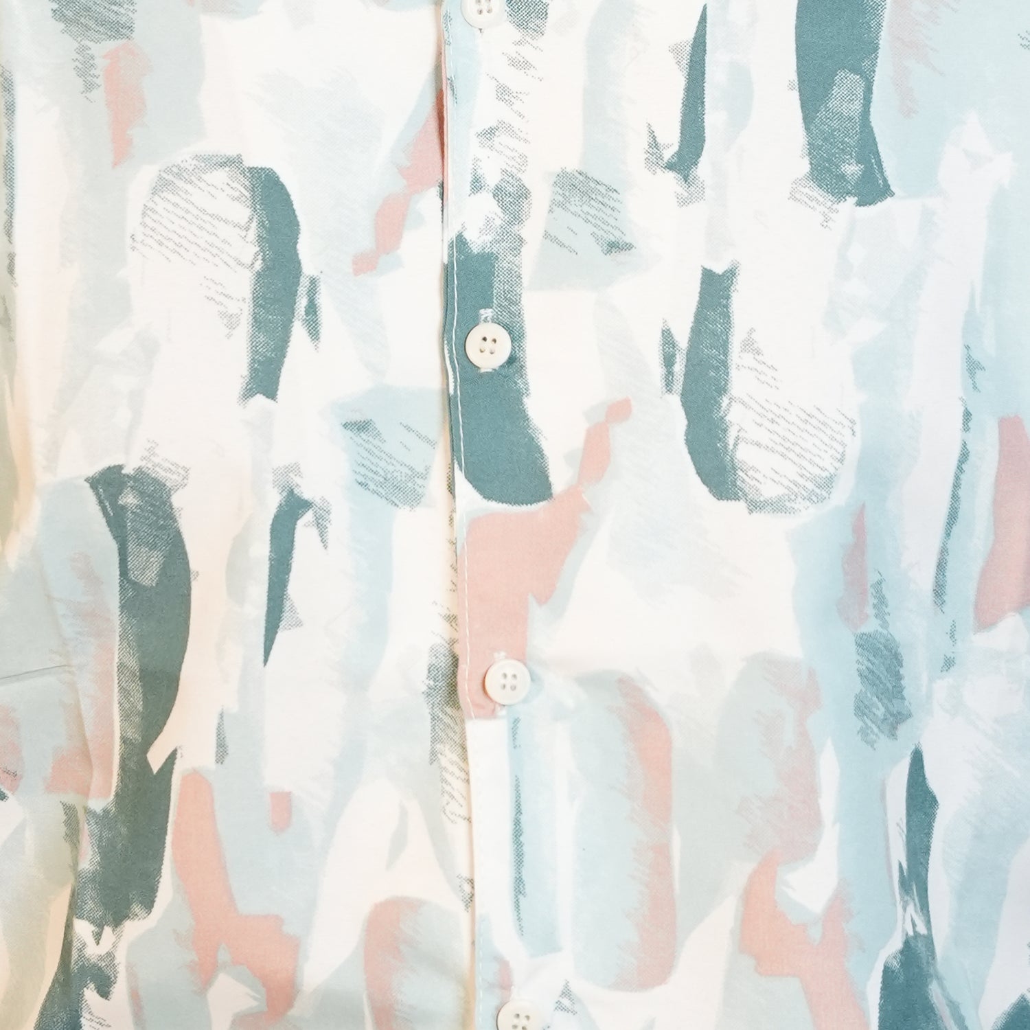 Close-up of a patterned shirt with abstract design