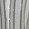 Close-up of a textured black and white striped shirt