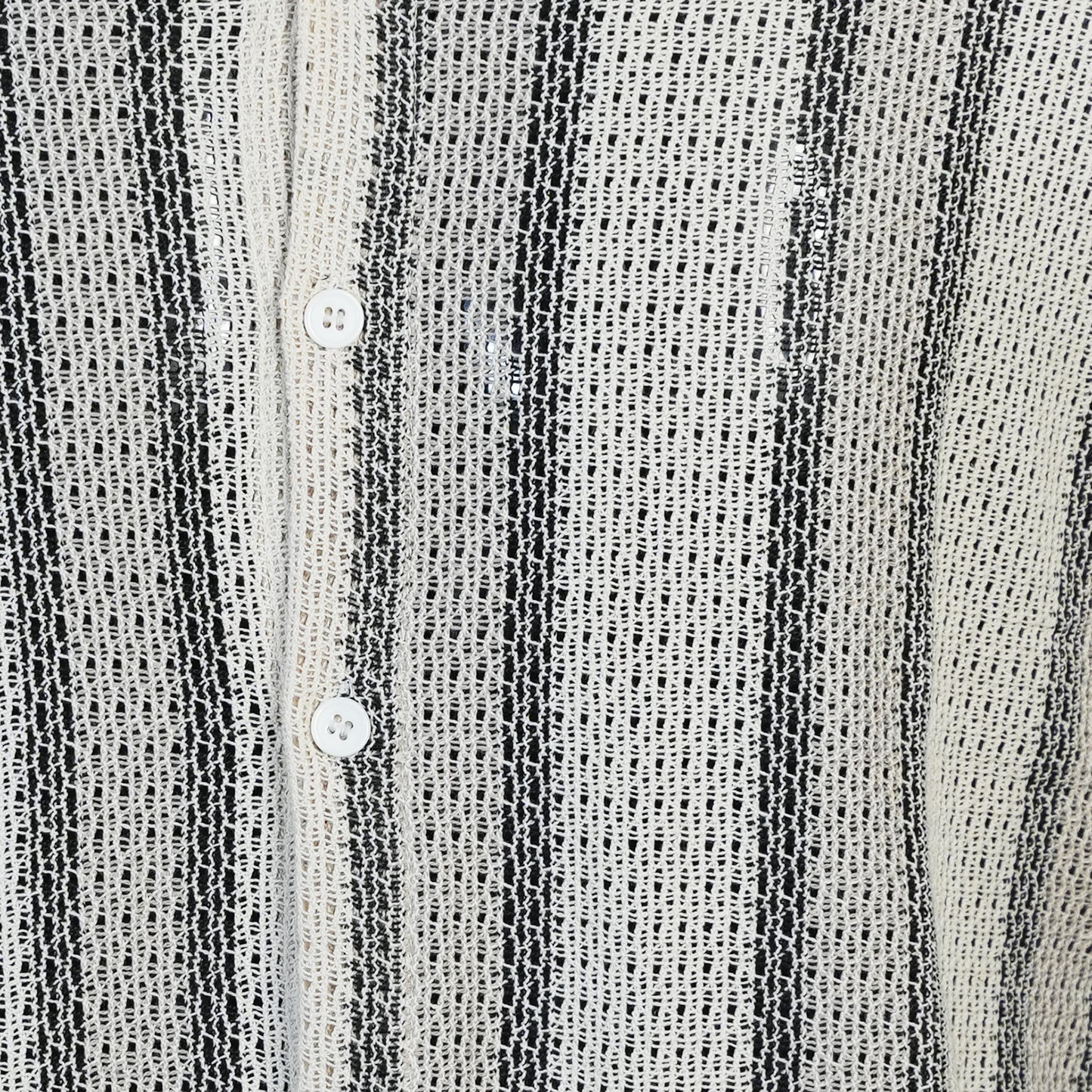Close-up of a textured black and white striped shirt