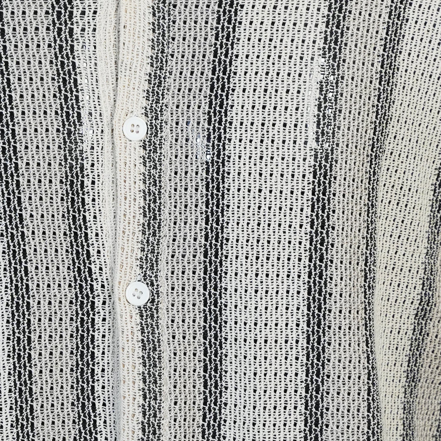 Close-up of a textured black and white striped shirt